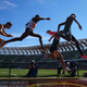 Donn Cabral, Sean McGorty and Hillary Bor race over the water jump in the steeplechase during the US Olympic Team Trials at Hayward Field.